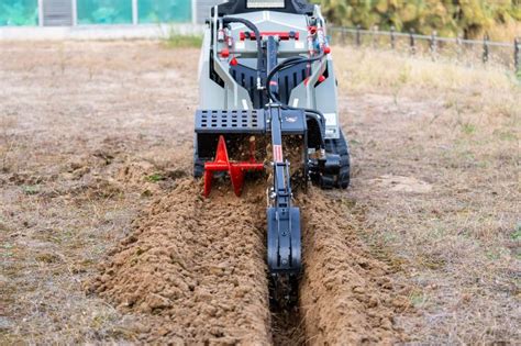 can a skid steer dig a driveway|do mini skids dig well.